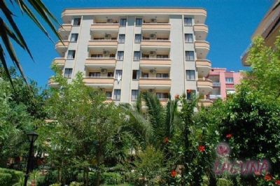 Otelimiz Antalya �ehir merkezinde , hem �ehir hemde tatil oteli olanaklar� ve �zelliklerine sahip 52 Adet �� odal� Suit ,12 Adet 1+1 Junior Suit toplam  64 dairel ve 196 yatak kapasiteli Turizm Bakanl��� belgeli 3 + y�ld�zl� bir tesistir.<br><br>  

Otelimiz ; Antalya havaliman�na 15 Km. mesafede , Antalya �ehrinin e�siz tarihi ve k�lt�rel �zelliklerini yans�tan , kendine �zg� mimari yap�s�yla 

tarihe tan�kl�k eden '' Y�VL� M�NARE '' ve B�g�n hala ya�ayan '' Eski �ehir '' g�r�n�m�ndeki '' Kale i�i '' semtine 900 metre uzakl�kta , Antalya 

�ehrinde ya�am�� t�m uygarl�klara be�iklik eden ve bu uygarl�klar�n ,K�lt�rlerin izlerini yans�tan '' Antalya M�zesine '' 350 Metre mesafede , 

D�nyan�n en �nl� ,en  uzun ve en  temiz sahillerine sahip Konyaalt� plaj�na ( Beach Park )  ta��tla sadece 5 dakika , Denize uzakl��� Ku� u�u�uyla 400 metre uzakl�ktad�r.

  

Otelimizde ( BB ) Oda kahvalt� , ( HB ) Yar�m Pansiyon , ( ALL.INKL) Her�ey dahil , ( APART ) Sadece daire. 

Sistemlerinin herbiri istege g�re uygulanmaktad�r.  
<br><br>Our hotel is in the city centre three star hotel with the city hotel opportunities and holiday hotel opportunities. We have 52  Suits with 3 bedroom, 12 junior bedroom with 1+1 bedroom as total 196 beds. <br><br>

It is only 15 km. from Antalya International Airport, 900 m. from old city centre and world famous Yivli Minare and Kalei�i, 350 m. from  museum of Antalya where you can see the traces and signs of many civilizations lived in Antalya, 5 minutes by bus to the one of the most famous, longest and cleanest of he world Konyaalri Beach and 400 m. to the see. 

  
You will be served (BB) Room �breakfast, (HB) half pansion, (ALL INCL.) All inclusive or (APART) only flat system up to your wish. 
